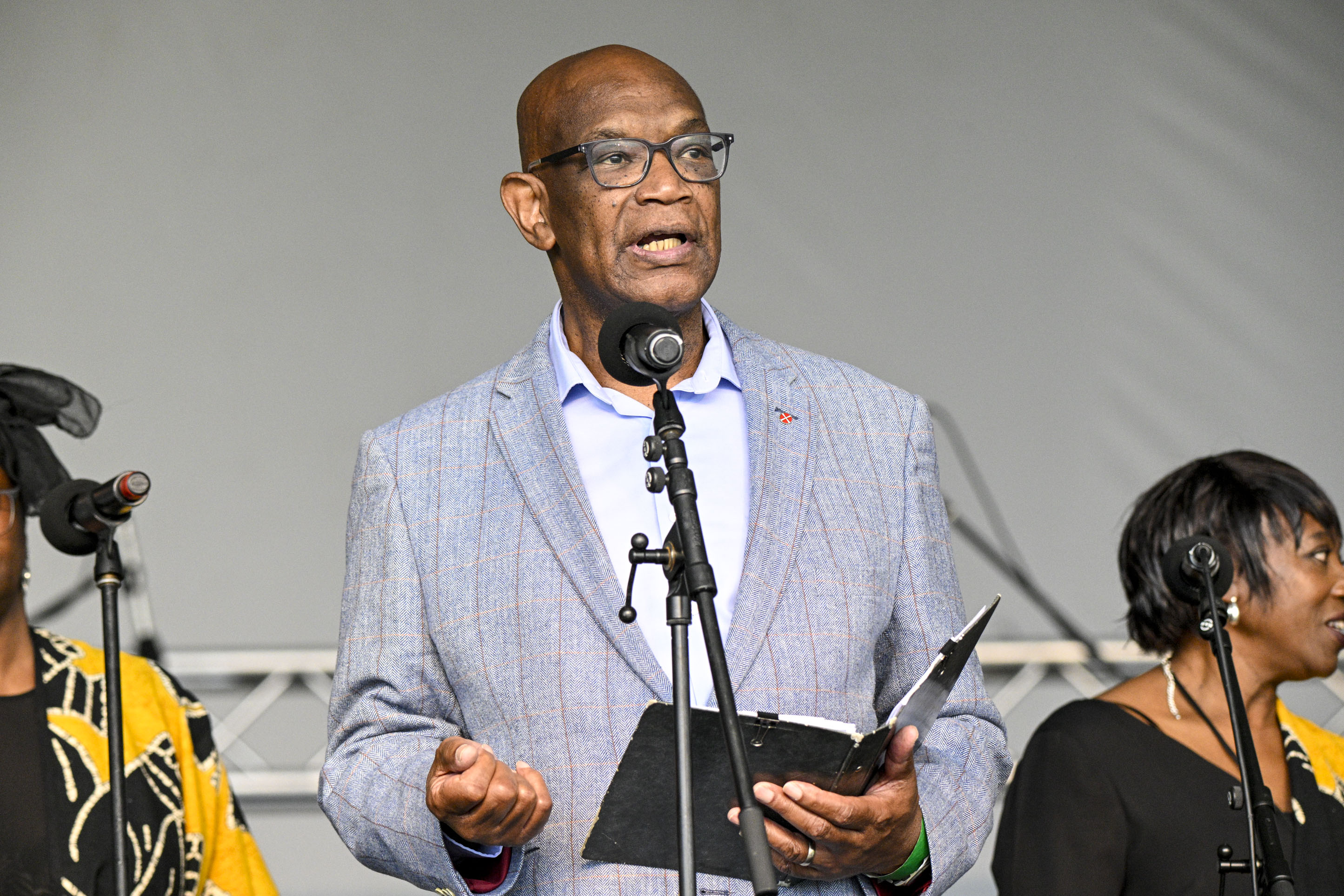 Reverend Ermal Kirby addresses the crowd during a moment of thanks