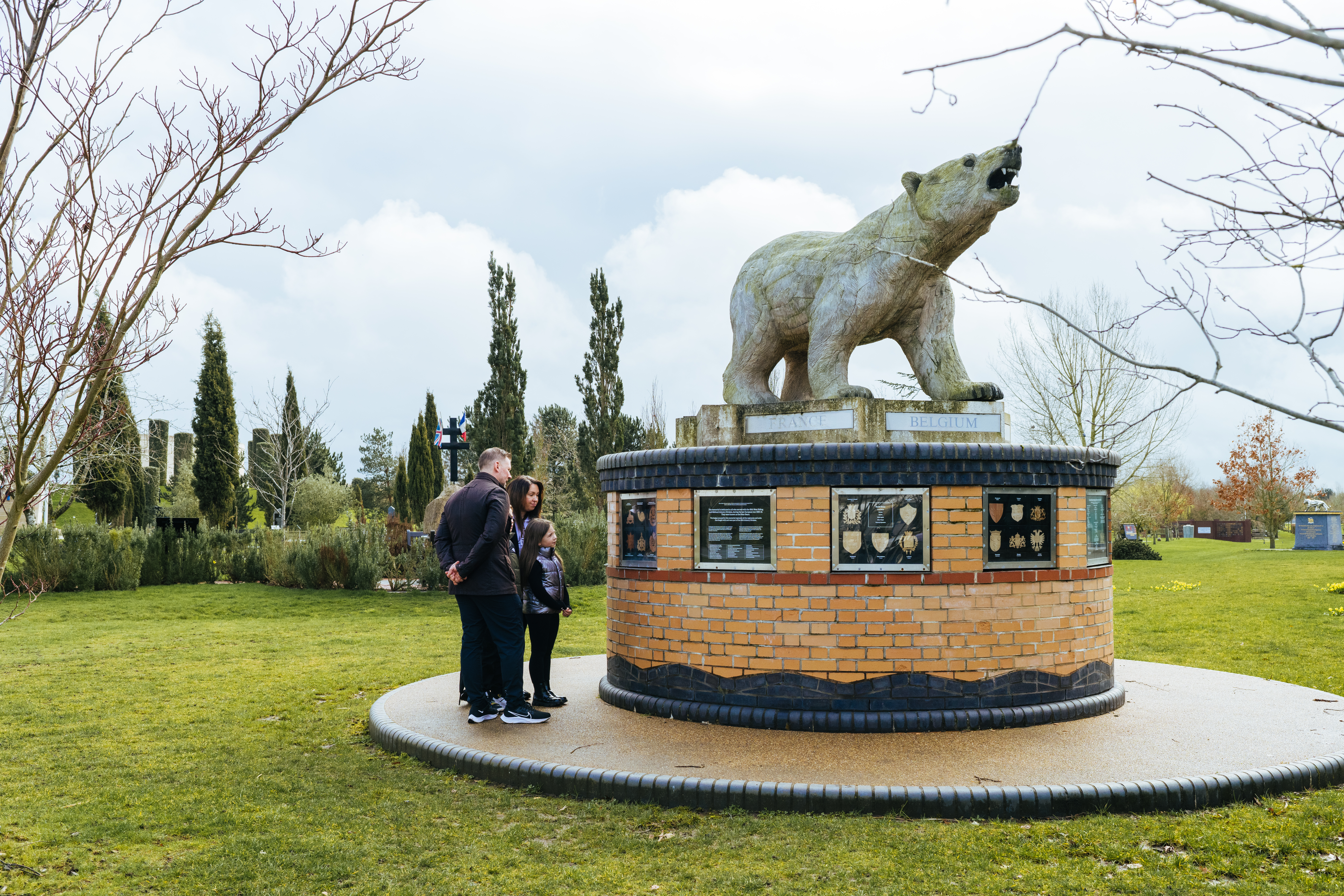 Family looking at the Polar Bear Memorial