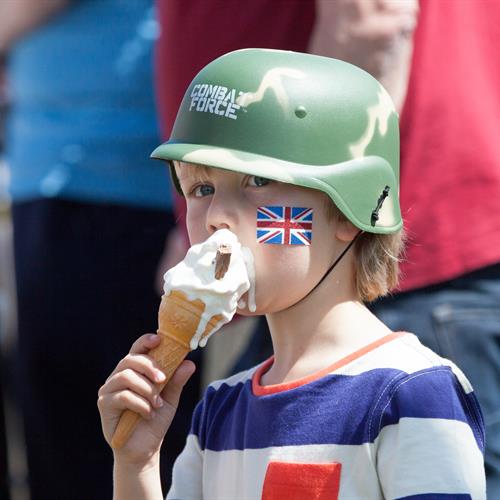 Boy eating ice cream and celebrating Armed Forces Day at the National Memorial Arboretum