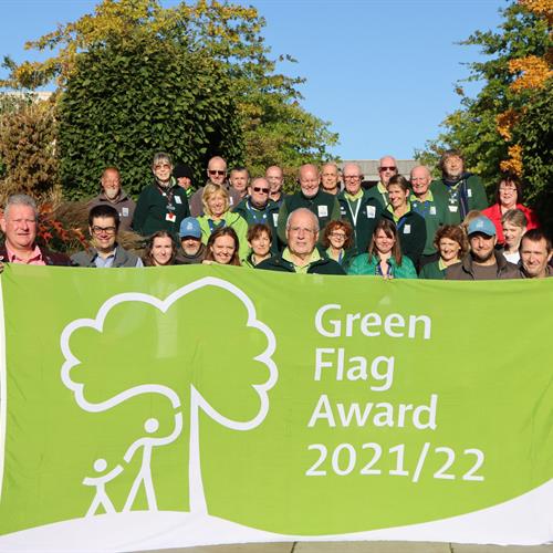 Arboretum Team holding the Green Flag