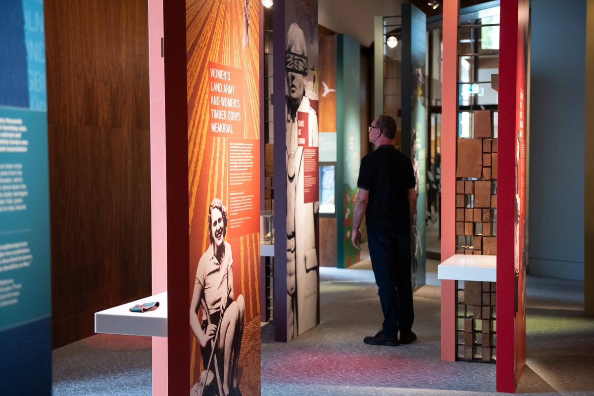 A visitor looks at an ehibition panel in the Landscapes of Life exhibition