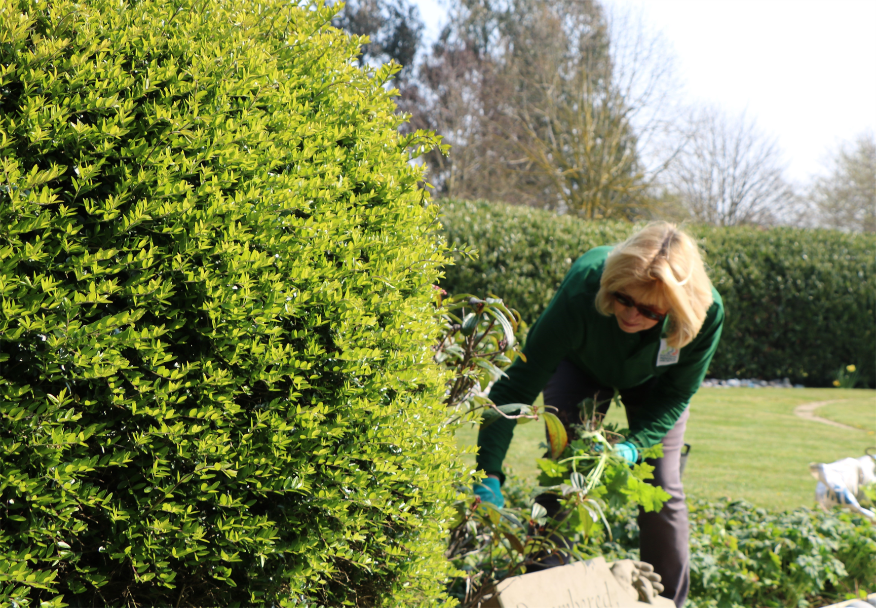 A volunteer working in the grounds.